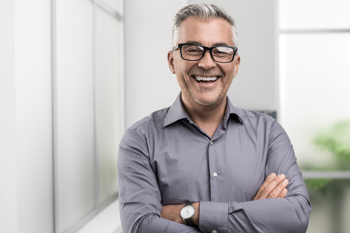 Confident businessman posing in the office